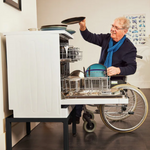 man met wasmachine verhoger